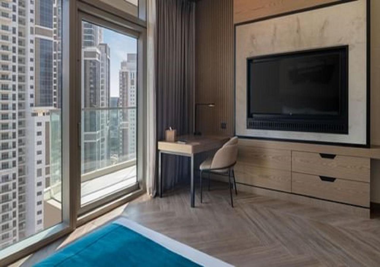 Paramount Hotel Midtown Dubaj Kültér fotó A bedroom at the hotel